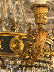 A Crystal and Gilt and Patinated Bronze Empire Style Chandelier