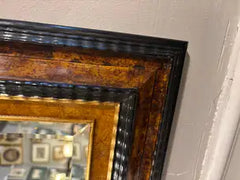 Dutch Baroque Style Ebonized Gilt Ripple Mold Framed Mirror with Beveled Glass