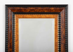 Dutch Baroque Style Ebonized Gilt Ripple Mold Framed Mirror with Beveled Glass