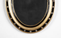 A Pair of 19th Century Irish Jeweled, Gilt and Ebonized Mirrors