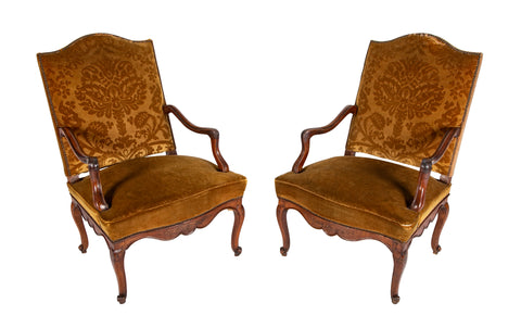 A Pair of French Carved Walnut Louis XIV Armchairs