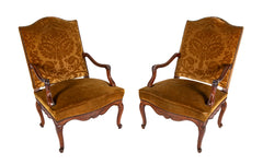 A Pair of French Carved Walnut Louis XIV Armchairs