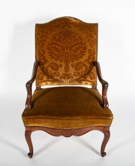 A Pair of French Carved Walnut Louis XIV Armchairs