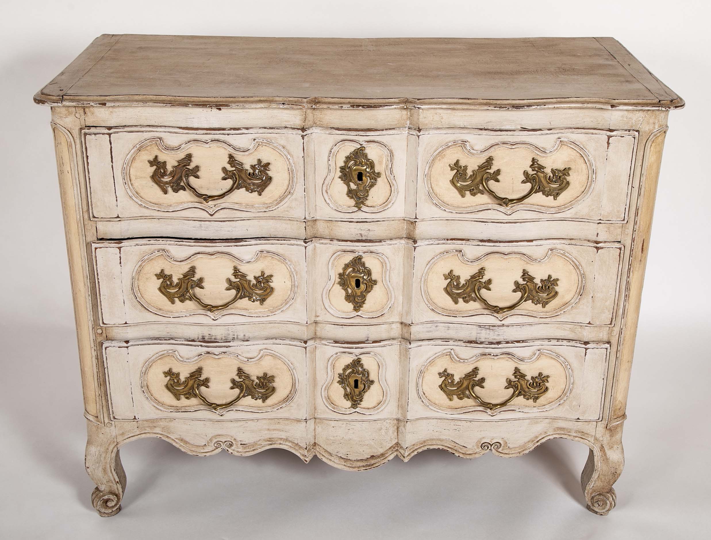 An 18th Century Robust French Provincial Serpentine Front Commode