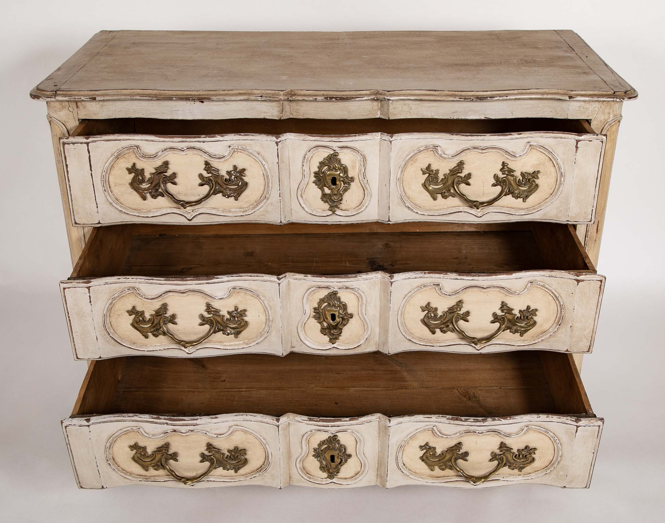 An 18th Century Robust French Provincial Serpentine Front Commode