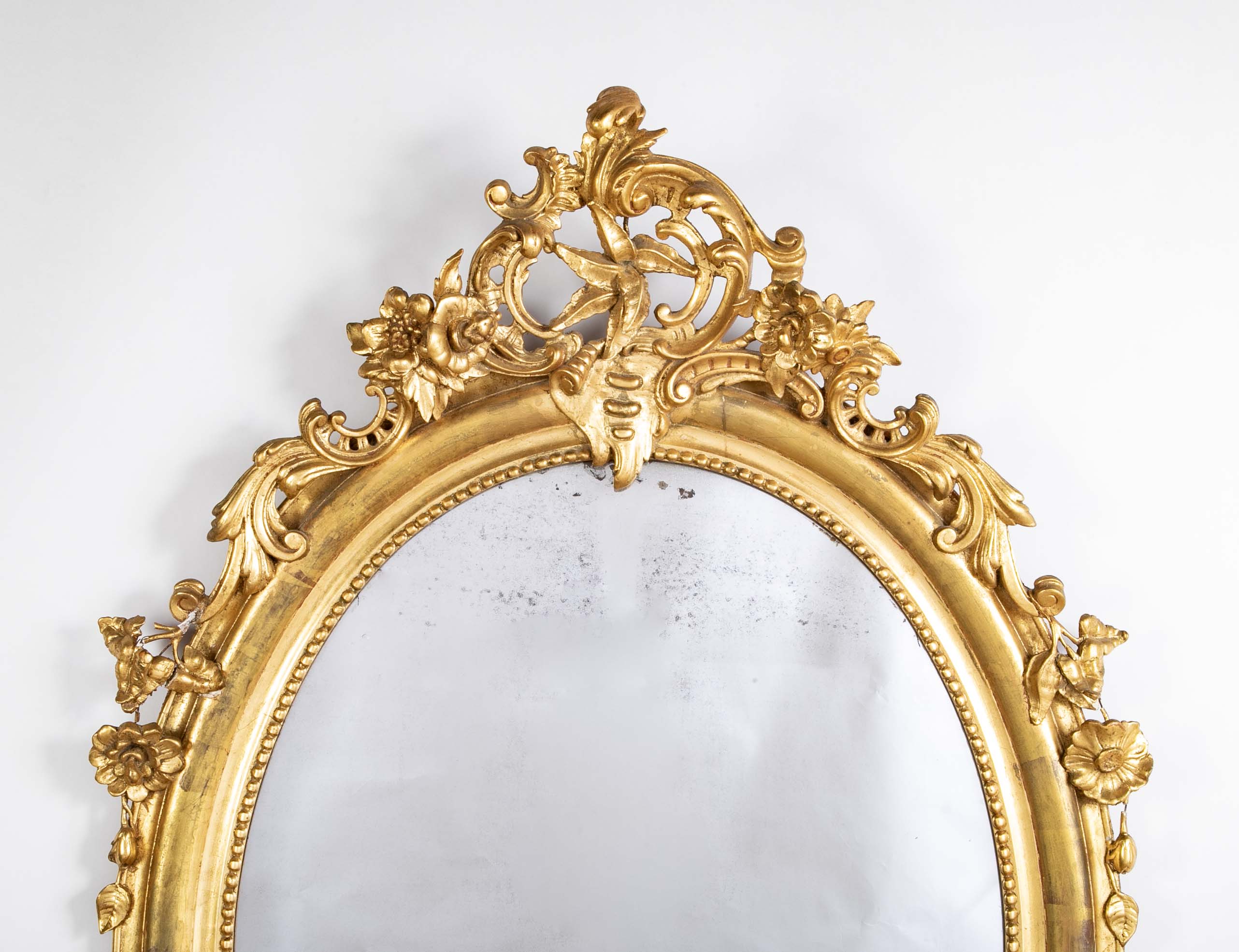An 18th Century French Carved & Gilt Oval Mirror