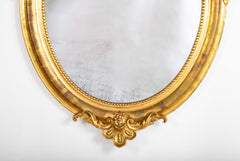 An 18th Century French Carved & Gilt Oval Mirror