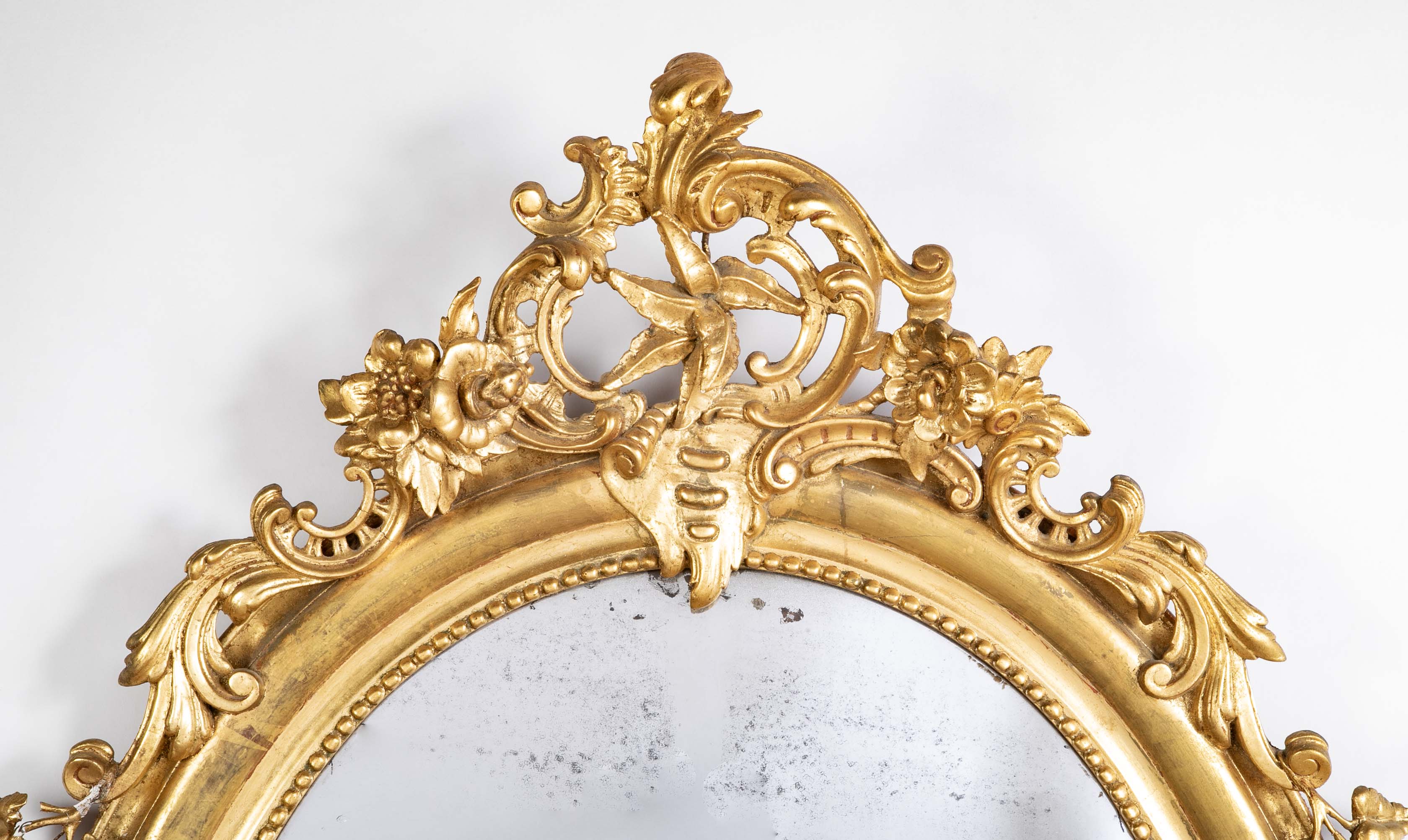 An 18th Century French Carved & Gilt Oval Mirror