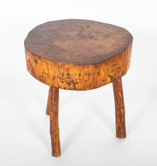 A Rustic Tripod Form Side Table with Tree Cross Section as Top