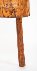 A Rustic Tripod Form Side Table with Tree Cross Section as Top