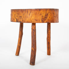 A Rustic Tripod Form Side Table with Tree Cross Section as Top