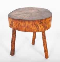 A Rustic Tripod Form Side Table with Tree Cross Section as Top