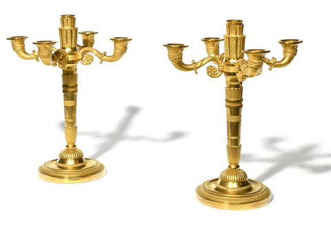 A Pair of Period Empire Gilt Bronze Candlesticks.