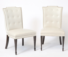 A Set of 12 Leather and Close Chrome Nailed Dining Chairs