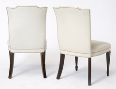 A Set of 12 Leather and Close Chrome Nailed Dining Chairs