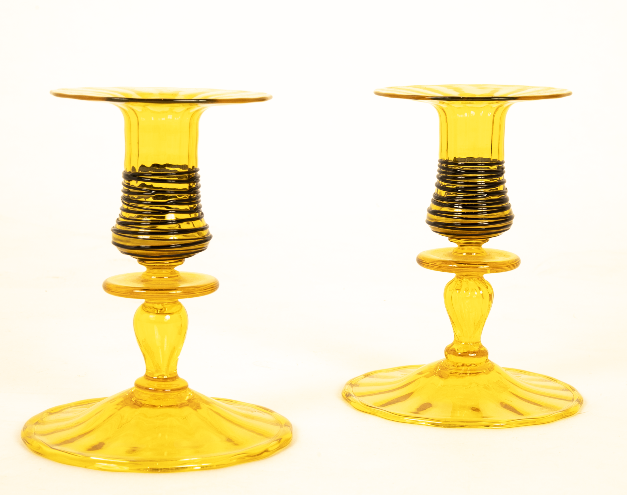 A Pair of Steuben Threaded Glass Candlesticks