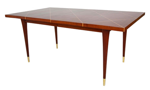 A Tommi Parzinger For Charak Modern Mahogany and Maple Dining Table With Leaves.