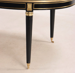 A Jansen Style Ebonized and Bronze Mounted Dining Table