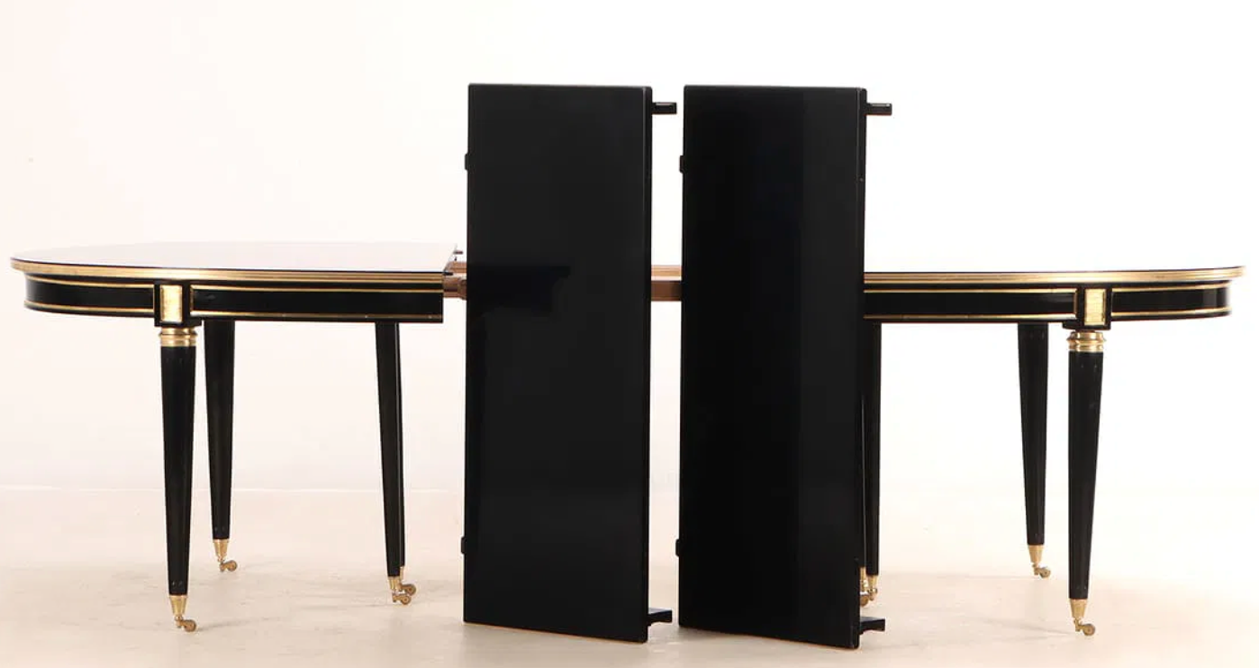 A Jansen Style Ebonized and Bronze Mounted Dining Table