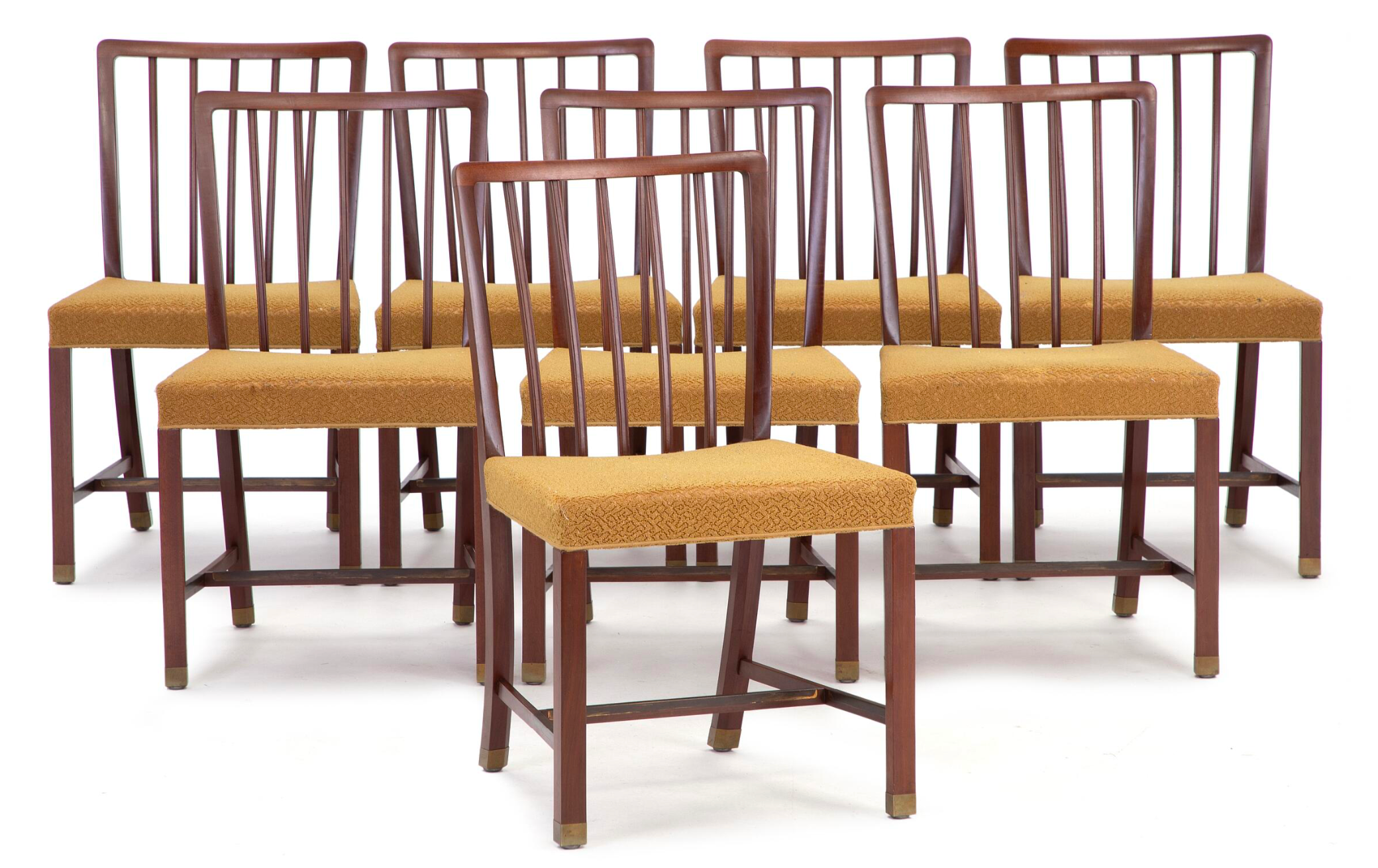 A Set of Eight Danish Mahogany and Brass Dining Chairs