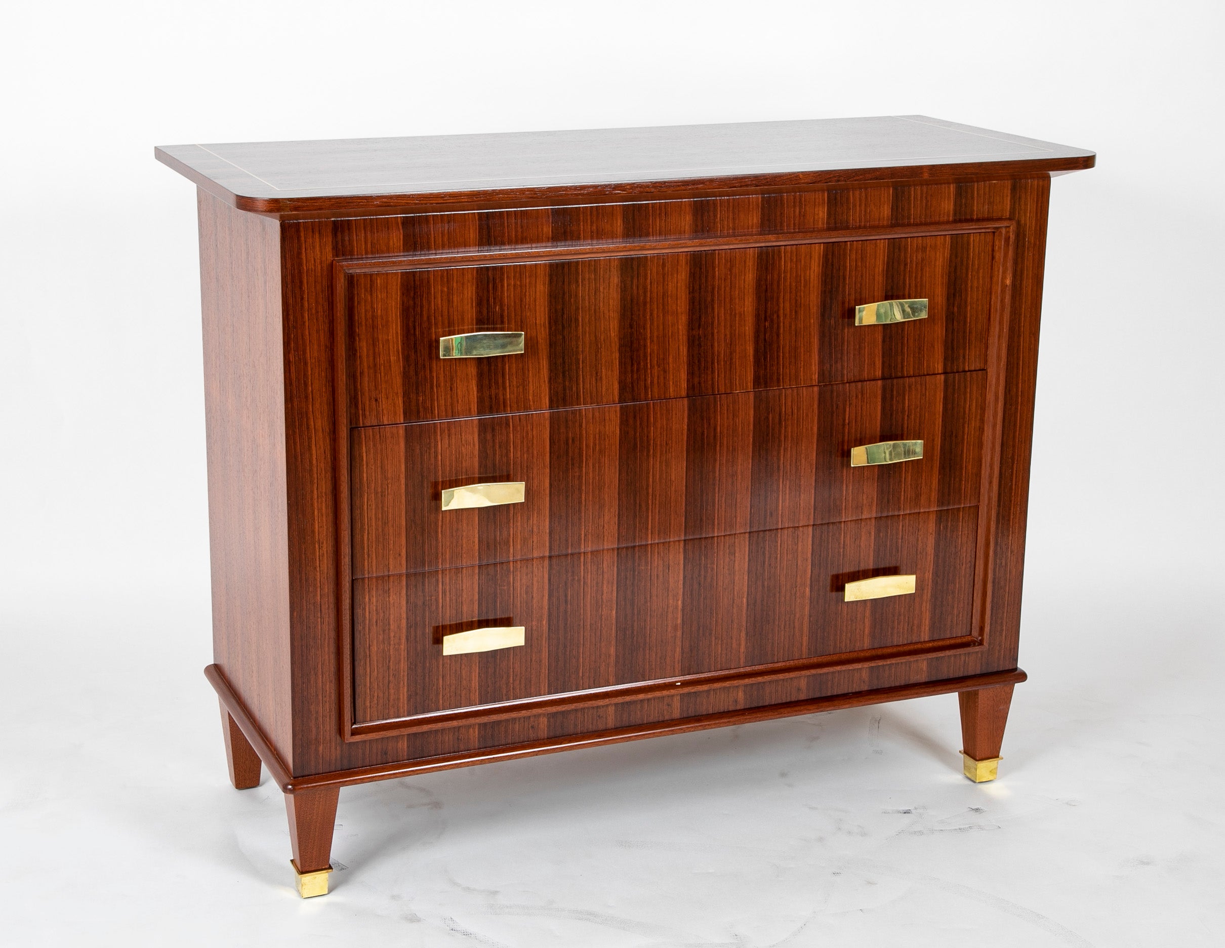 A Three Drawer Rosewood Commode in the Manner of Jacques Adnet