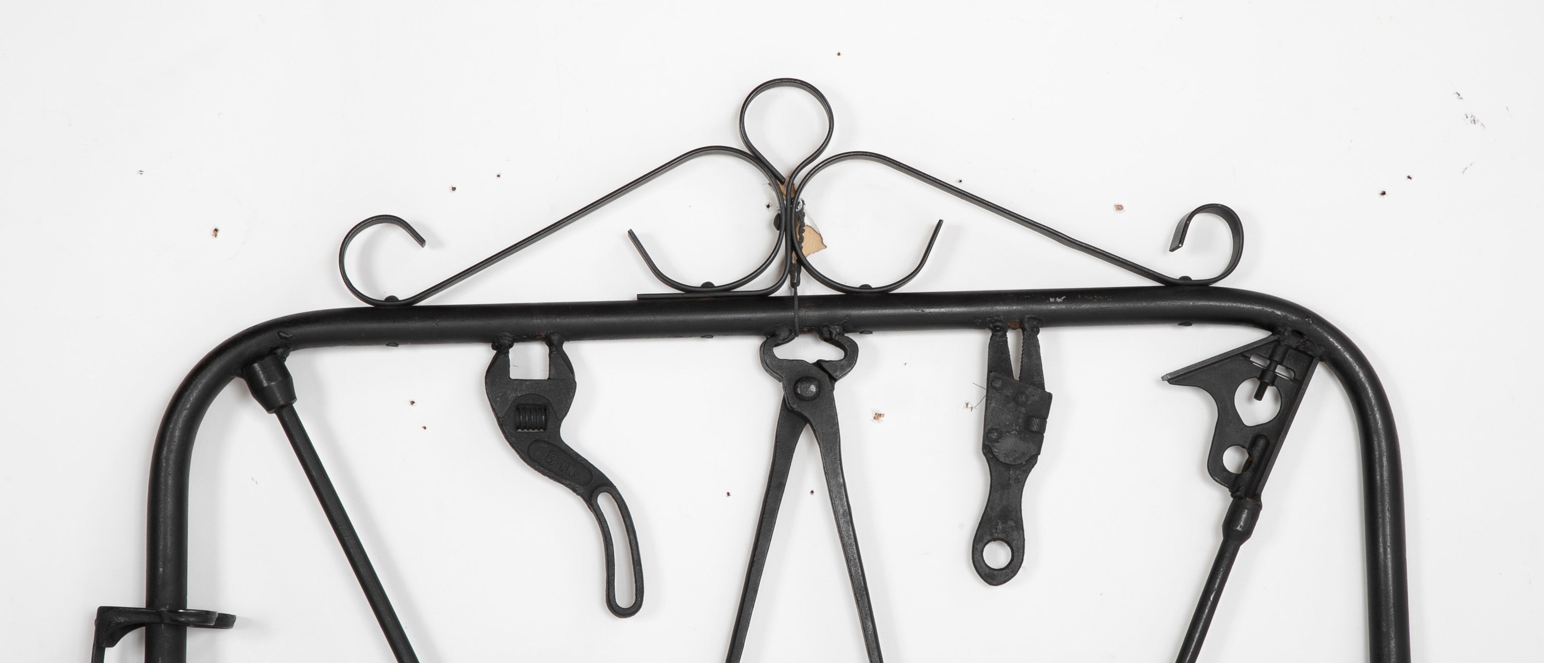 A Garden Gate in Wrought Iron with Antique Farm Tools by Rodney Rosebrook
