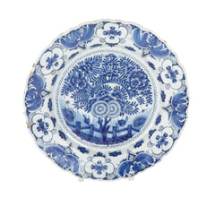 A Delft Blue & White Charger Depicting Blossoms from a Rock
