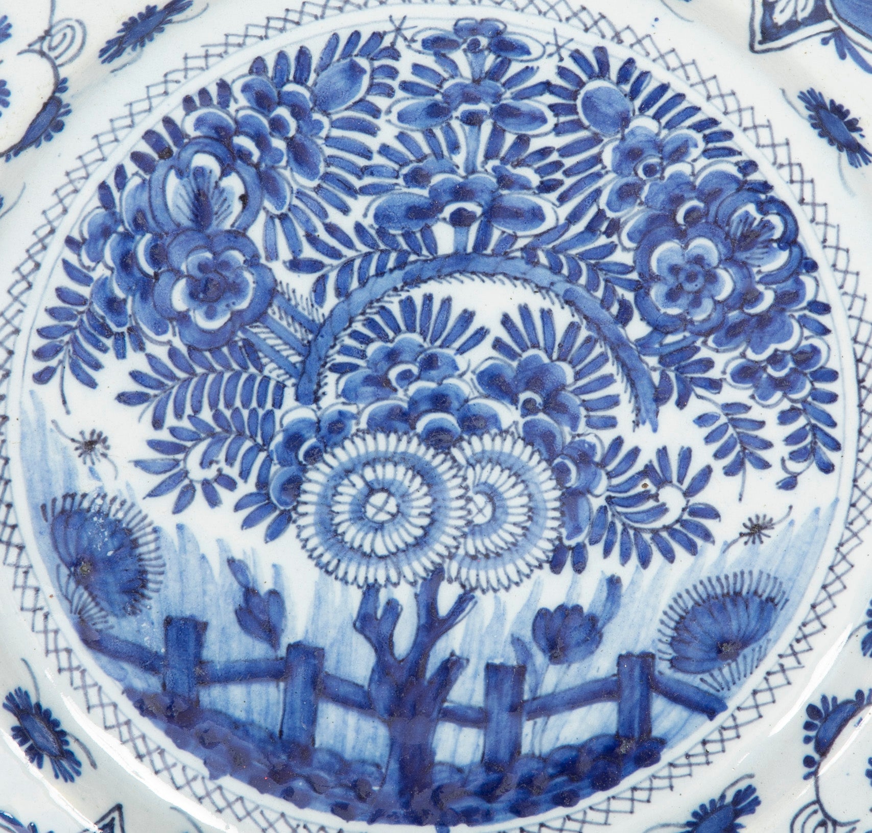 A Delft Blue & white Charger Depicting Blossoms from a Rock
