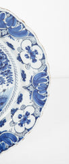 A Delft Blue & White Charger Depicting Blossoms from a Rock