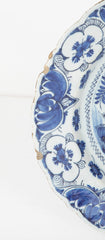 A Delft Blue & White Charger Depicting Blossoms from a Rock
