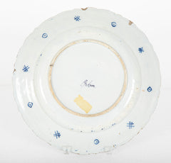 A Delft Blue & White Charger Depicting Blossoms from a Rock