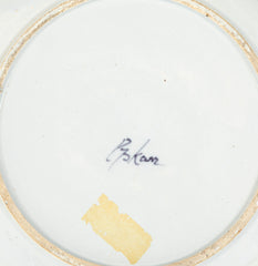 A Delft Blue & White Charger Depicting Blossoms from a Rock