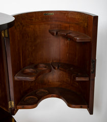 An Oval Shaped Mahogany Bar Cabinet