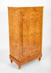 A French Burlwood Cabinet on Bronze Sabots