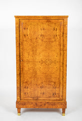 A French Burlwood Cabinet on Bronze Sabots