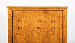 A French Burlwood Cabinet on Bronze Sabots