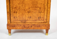 A French Burlwood Cabinet on Bronze Sabots