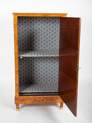 A French Burlwood Cabinet on Bronze Sabots