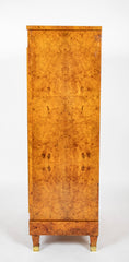 A French Burlwood Cabinet on Bronze Sabots
