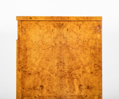 A French Burlwood Cabinet on Bronze Sabots