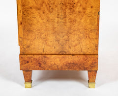 A French Burlwood Cabinet on Bronze Sabots