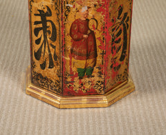 A Chinese Black & Gilt on Red Decorated Tole Octagonal Cannister with Figure