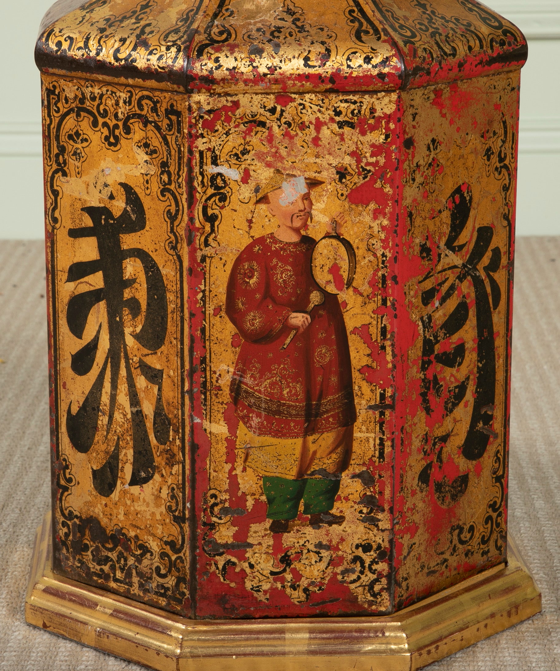 A Chinese Black & Gilt on Red Decorated Tole Octagonal Cannister with Figure