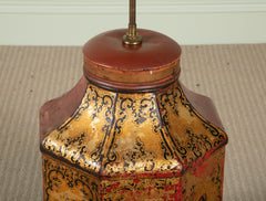 A Chinese Black & Gilt on Red Decorated Tole Octagonal Cannister with Figure