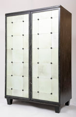 A Two Door Ebonized and Cerused Cabinet