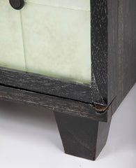 A Two Door Ebonized and Cerused Cabinet