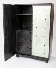 A Two Door Ebonized and Cerused Cabinet