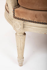 A Pair of Louis XVI Style Suede and Painted Armchairs by Maison Jansen