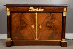 A Molitor French Empire Flame Mahogany and Gilt Bronze Commode with Rouge Griotte