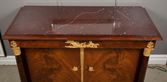 A Molitor French Empire Flame Mahogany and Gilt Bronze Commode with Rouge Griotte